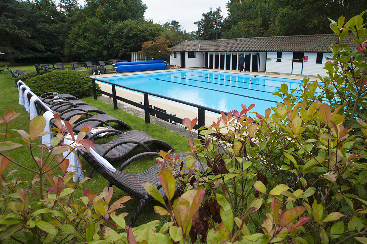 Lido with loungers and outdoor seating at Sunday Box Hill Burford Bridge Hotel